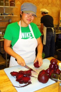 Boobs4Food SF Team Member Jessica cleaning & peeling nutrition rich red beets at Three Stone Hearth.